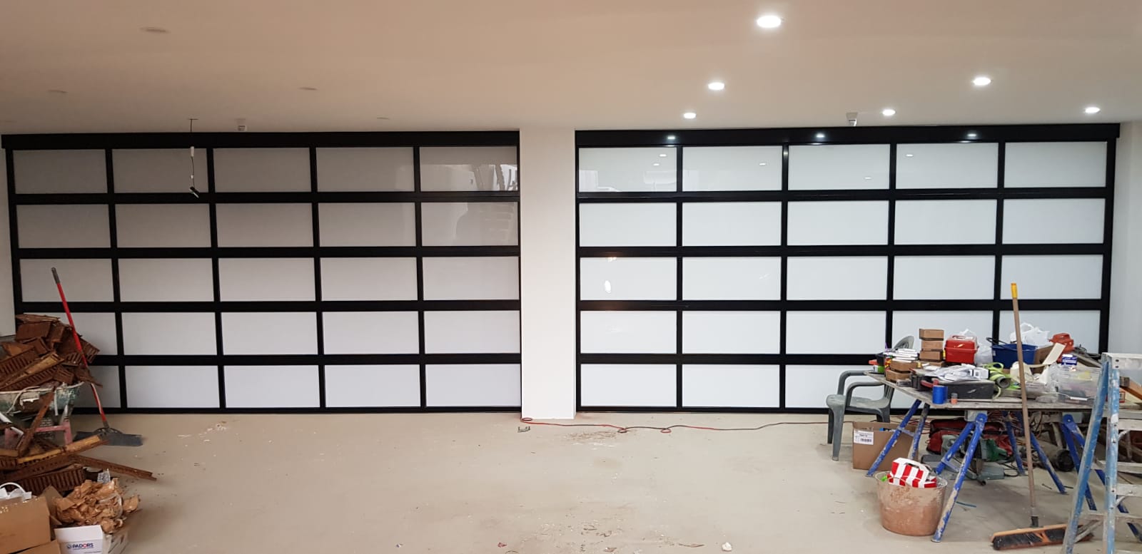 Aluminium frame sectional garage door with glass panels Auckland