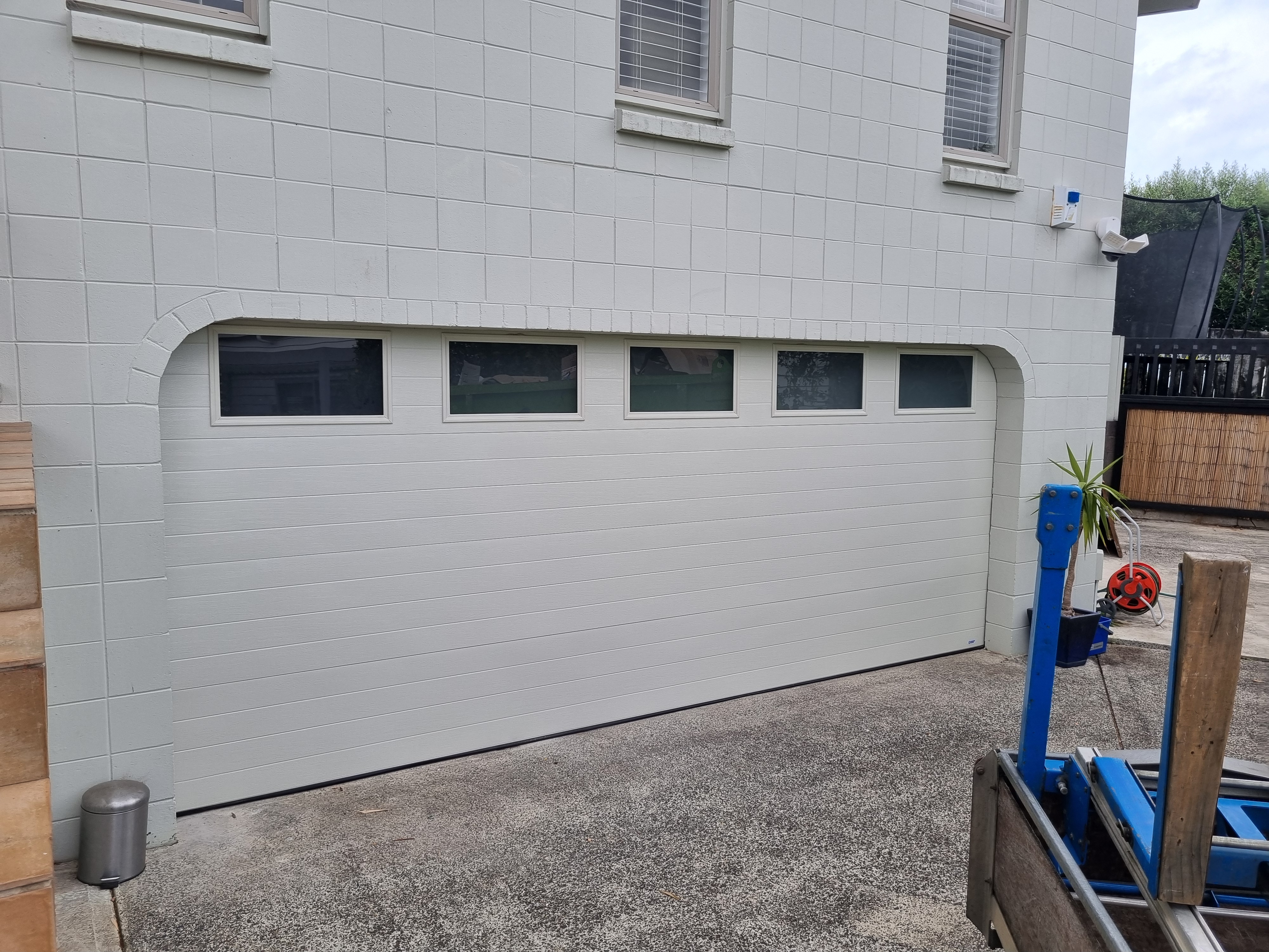 Insulated sectional garage door with windows installed in Auckland